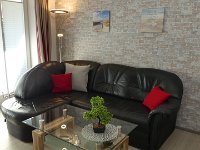 Wohnbereich  Wohnbereich mit Ledersofa und Couchtisch